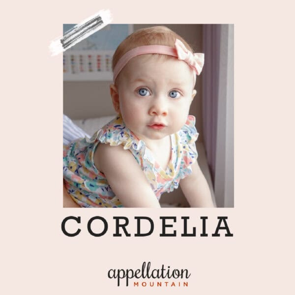 baby girl with light pink headband and floral print top; "baby name Cordelia"