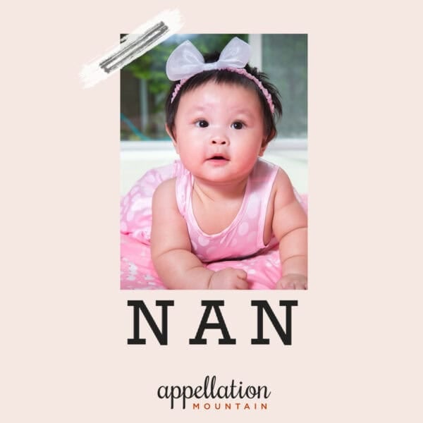 baby girl with Asian features and dark, short hair wearing pink dress and headband "baby name Nan"