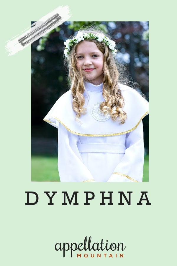 blonde girl wearing white long sleeve dress with cape and wreath of white flowers; baby name Dymphna