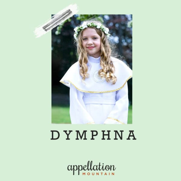 blonde girl wearing white long sleeve dress with cape and wreath of white flowers; baby name Dymphna