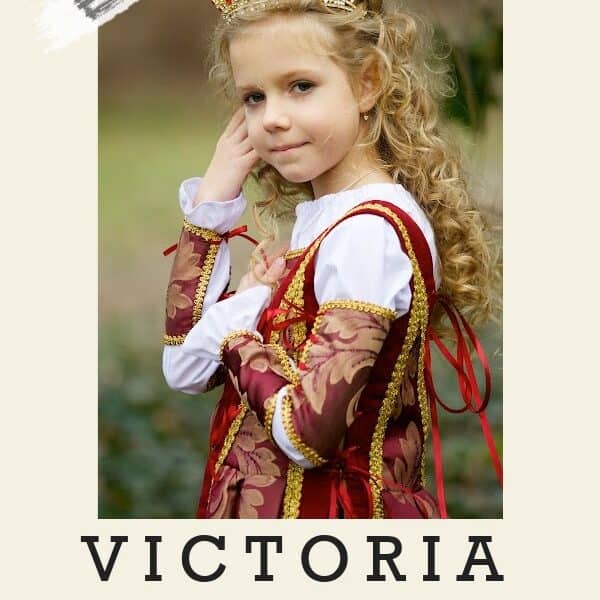 girl with long blonde curly hair wearing medieval-style burgundy and gold gown plus small golden crown; baby name Victoria