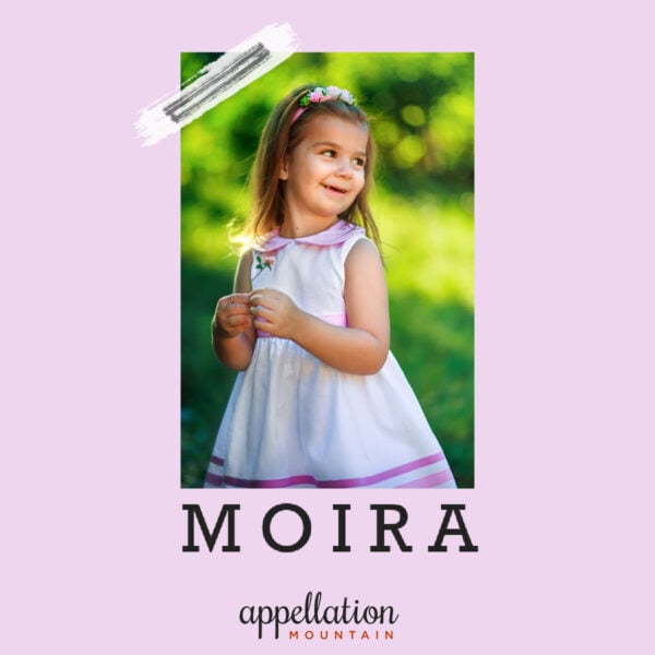 young girl in white dress with lavender accents standing outside in a park; baby name Moira
