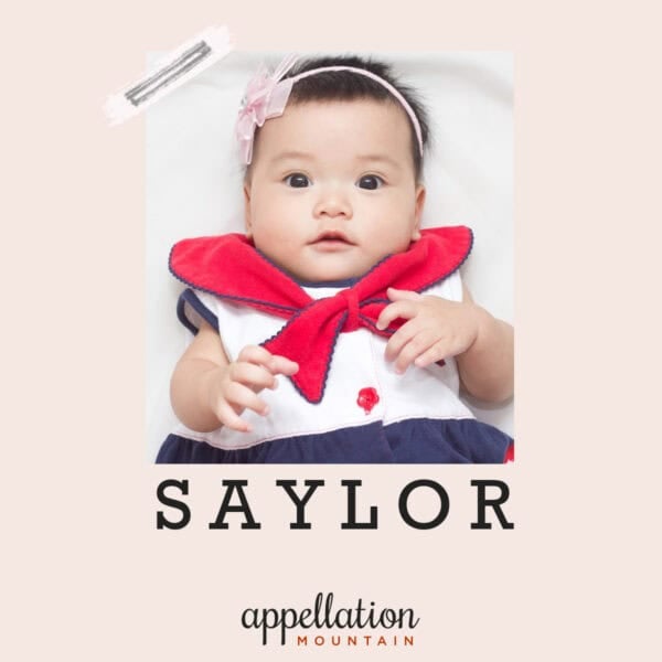 baby girl with dark hair wearing red white and blue sailor-style outfit; baby name Saylor
