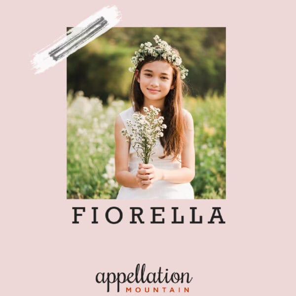 girl with long dark hair wearing white dress, flower crown, and holding flowers with text Fiorella