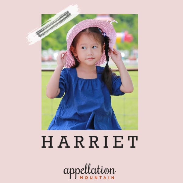 young girl in blue dress and pink sun hat "baby name Harriet"