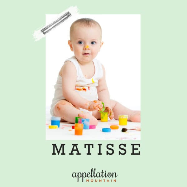 baby sitting up wearing white tank surrounded by small, colorful paint containers; "baby name Matisse"