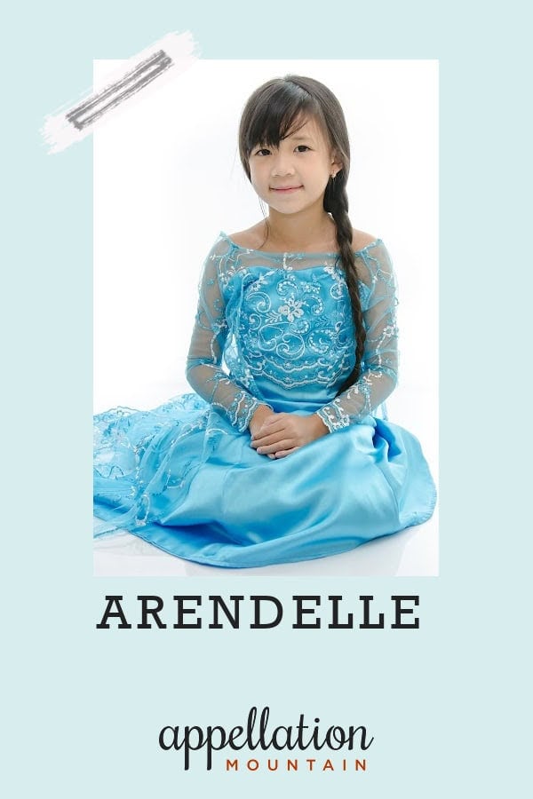 dark-haired young girl sitting on floor wearing Elsa/Frozen style dress with hair in a braid; baby name Arendelle