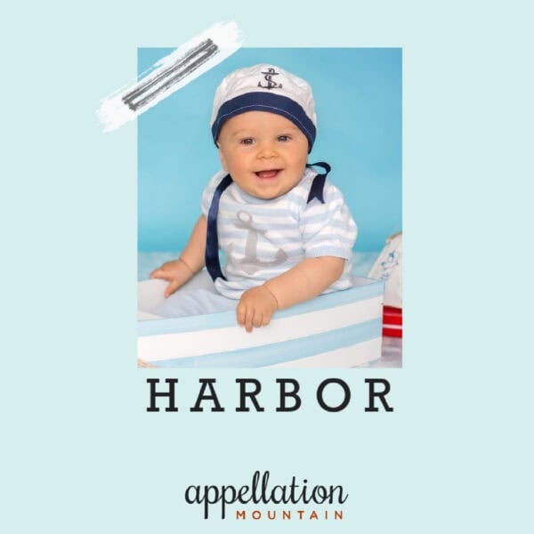 baby in sailor hat and nautical outfit with blue striped boat; baby name Harbor