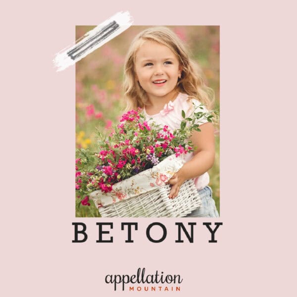 young girl with blonde wavy hair carrying white basket of pink flowers; baby name Betony