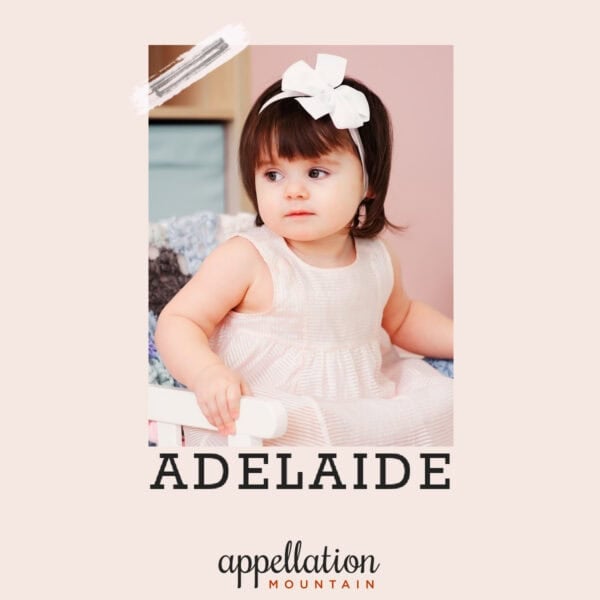 toddler girl with dark wearing white floral headband and pale pink dress; baby name Adelaide