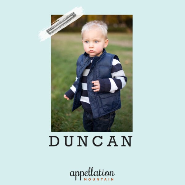 blonde toddler wearing blue and white striped sweater and blue puffer vest; baby name Duncan