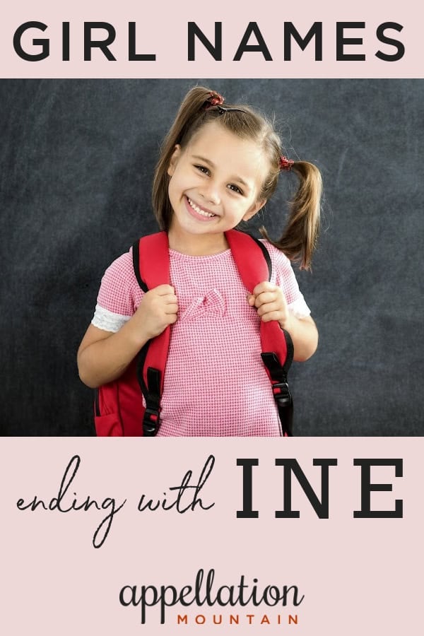 school-aged girl with dark blonde ponytails wearing pink tee and backpack standing in front of chalkboard; girl names ending with INE