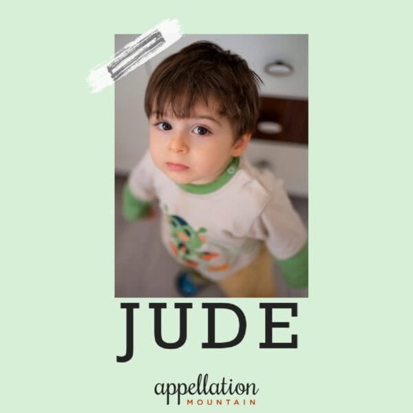 toddler boy with dark hair and dark eyes wearing pajamas; baby name Jude
