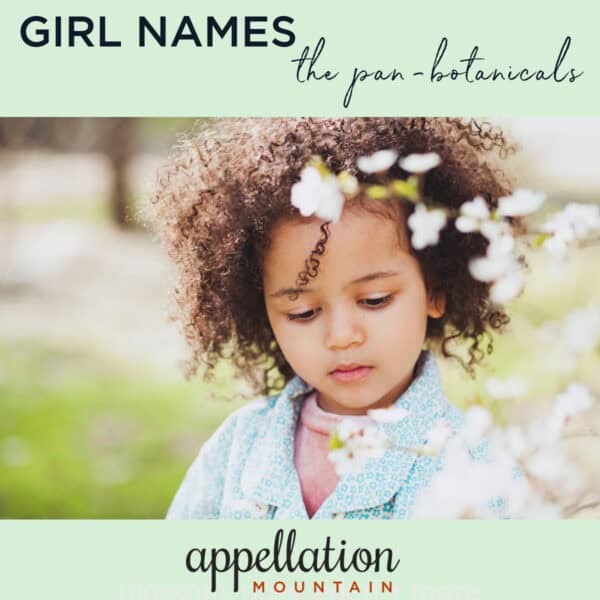 girl child with dark curls standing beneath flowering tree; botanical girl names