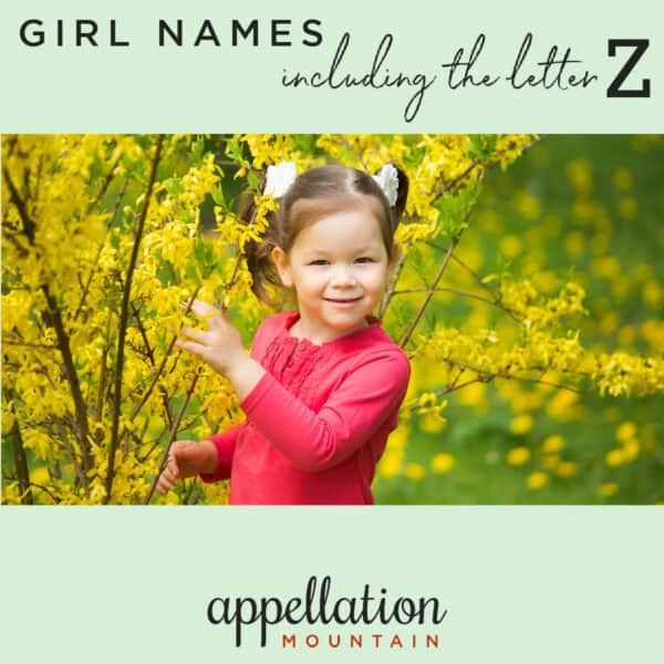 young girl with dark hair in ponytails and reddish pink shirt outside with tree with yellow flowers; "girl names with Z in them"