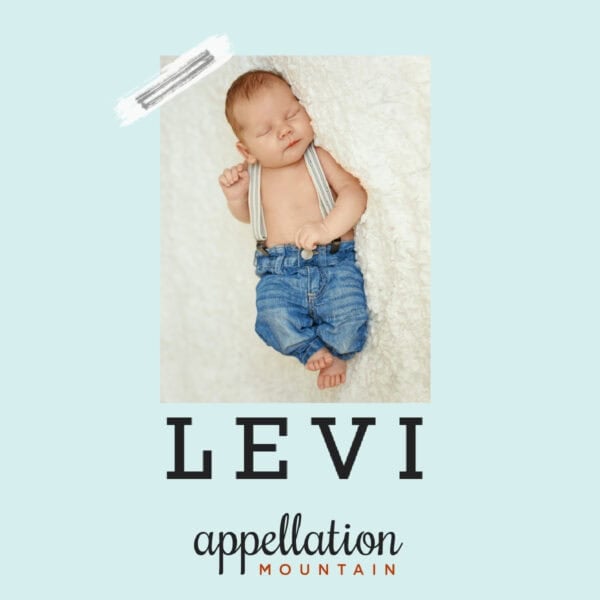 sleeping baby boy wearing blue jeans with suspenders; baby name Levi