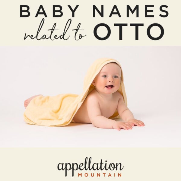 baby lying prone pushed up on forearms under butter yellow blanket; names like Otis and Otto names