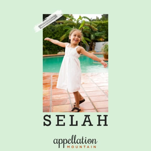 girl child wearing white dress standing on pool deck; baby name Selah