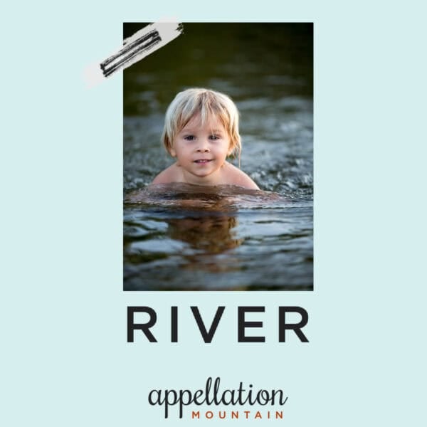 young child with blonde hair swimming in water; baby name River