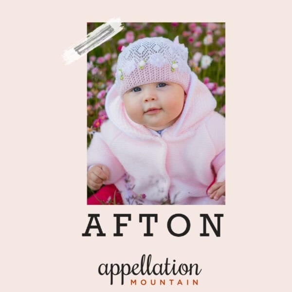 baby girl wearing white knit hat and pink jacket; baby name Afton