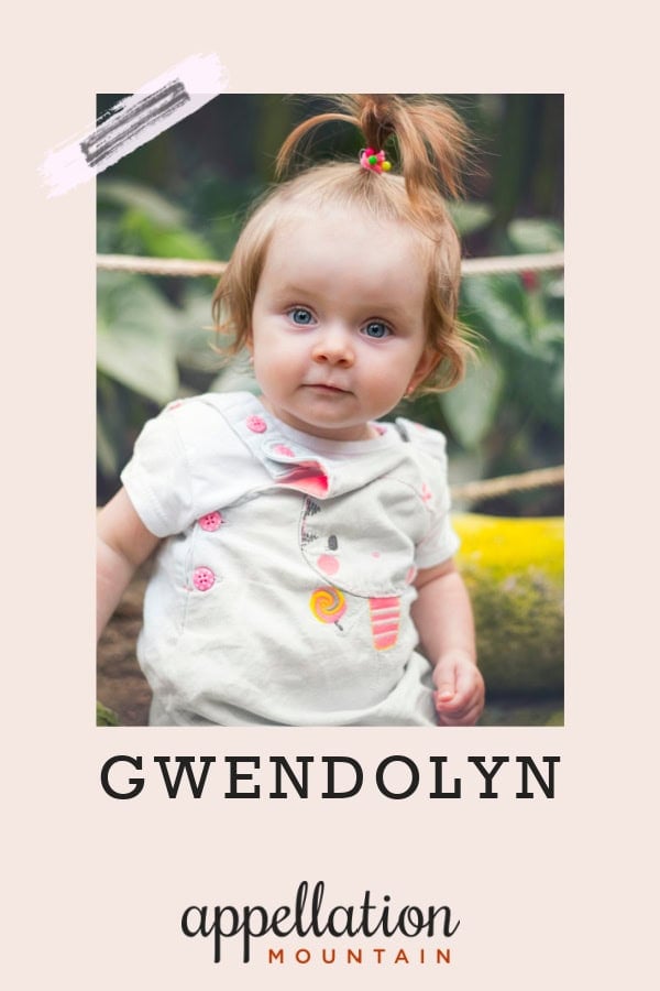 toddler girl with high ponytail standing outside; baby name Gwendolyn
