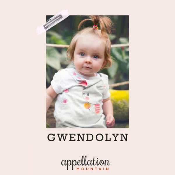 toddler girl with high ponytail standing outside; baby name Gwendolyn
