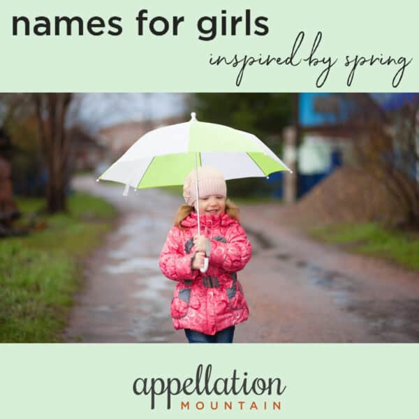 young girl wearing pink coat and holding light green striped umbrella "spring names for girls"