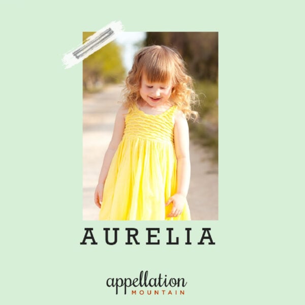 girl with blonde hair wearing yellow dress; baby name Aurelia