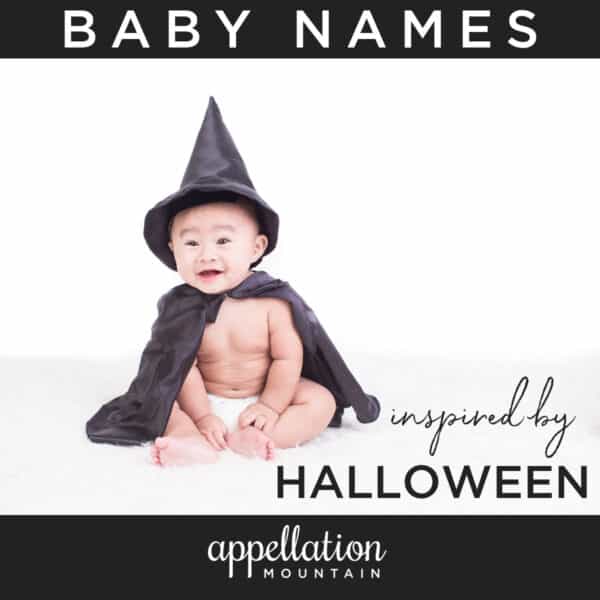 Asian baby wearing black witch hat and cape; baby names inspired by Halloween