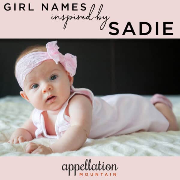 baby girl wearing pink lace bow, lying on her stomach; girl names like Sadie