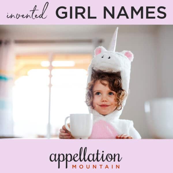 toddler girl with brown girls wearing unicorn suit holding coffee mug; invented girl names and made up girl names