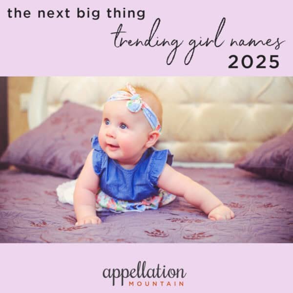 girl baby wearing blue dress and headband on bed with light purple blanket; "future Top 1000 girl names"