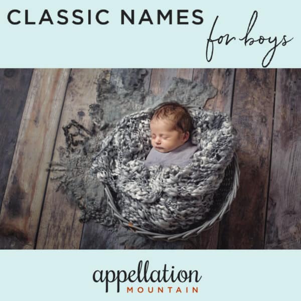 baby boy in basket with gray blankets against wood floor backdrop; Classic Names for Boys