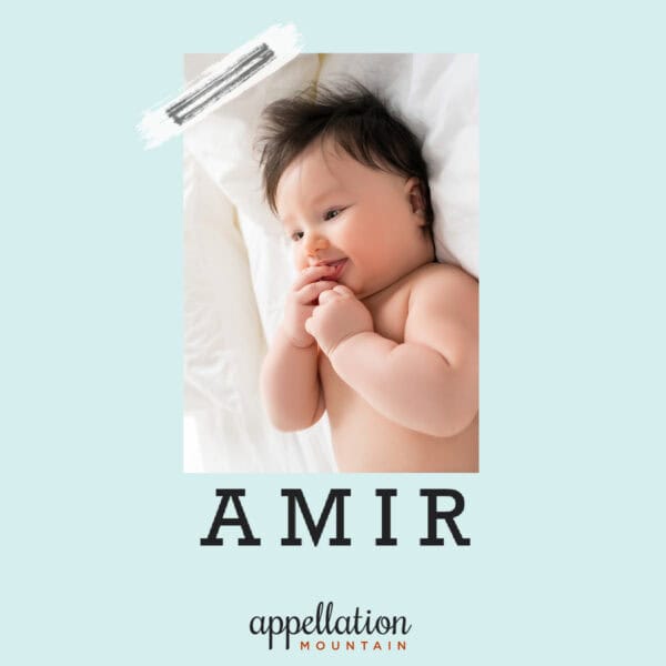 baby boy with dark hair on white sheets; "baby name Amir"