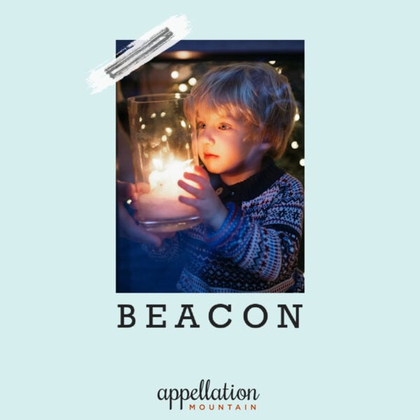 blonde boy child holding light; baby name Beacon
