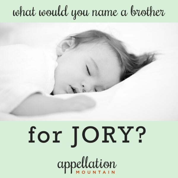 baby boy with dark hair sleeping on white sheets, "a brother for Jory"