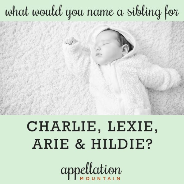 sleeping baby with dark hair wearing white sleep suit with hood on white rug; "name a sibling for charlie, lexie, arie & hildie"