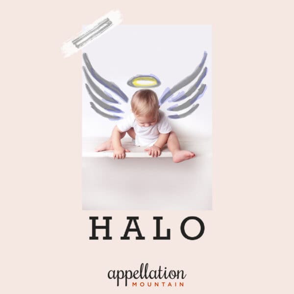 baby in white onesie sitting on shelf with drawn-in halo and wings "Baby Name Halo"