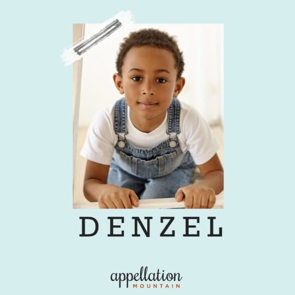 boy with light brown skin and short hair wearing white tee shirt and denim overalls; baby name Denzel