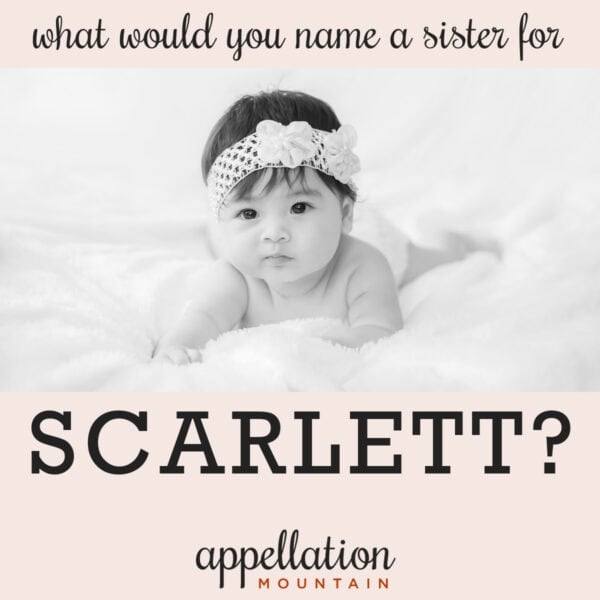 baby girl with dark hair resting prone propped up on arms, wearing headband "is Arietta the best name for Scarlett's sister?"