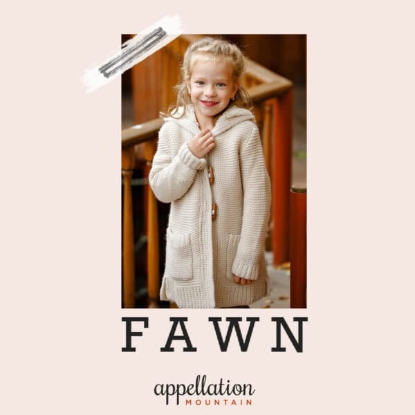 girl child with blonde hair wearing off white long knit jacket; baby name Fawn