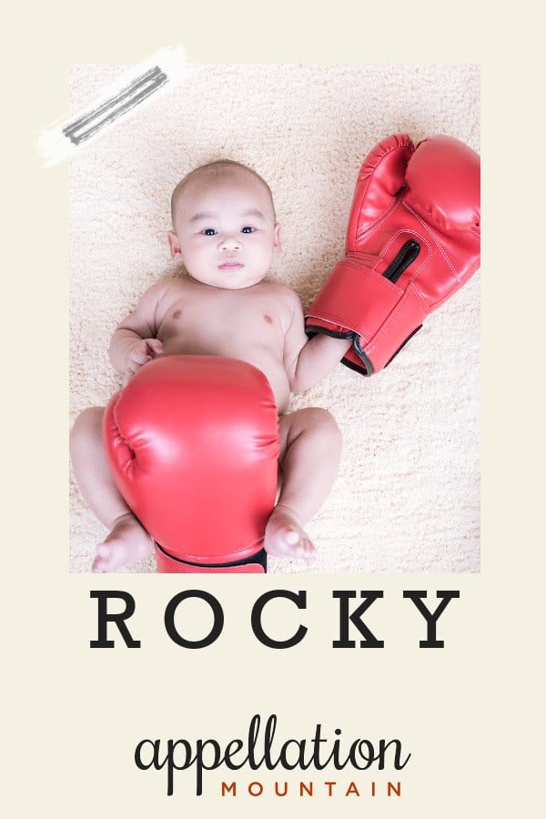 baby boy wearing oversized boxing gloves; baby name Rocky