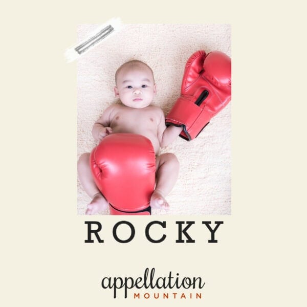 baby boy wearing oversized boxing gloves; baby name Rocky