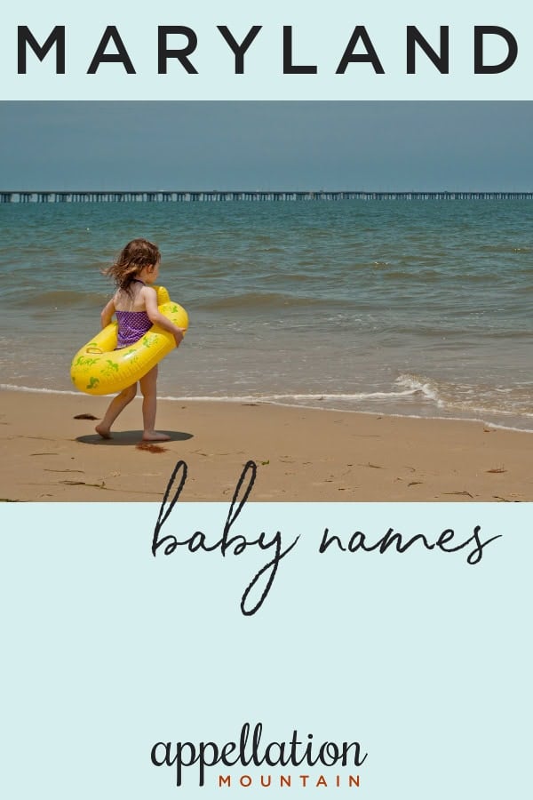 young girl wearing swimsuit and yellow inner tube walking toward Chesapeake Bay; Maryland baby names