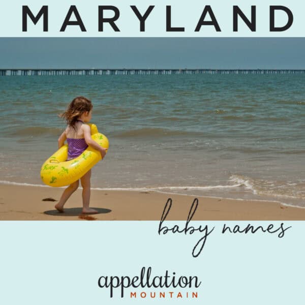 young girl wearing swimsuit and yellow inner tube walking toward Chesapeake Bay; Maryland baby names