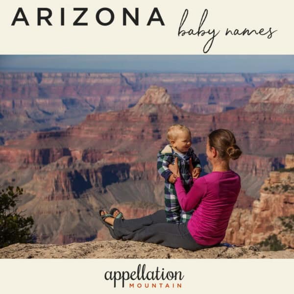 woman sitting on ground holding baby in front of Grand Canyon; Arizona baby names