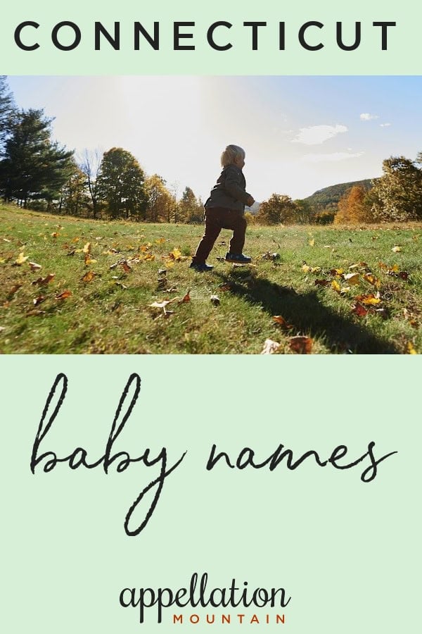 child running in field with fallen leaves; Connecticut baby names