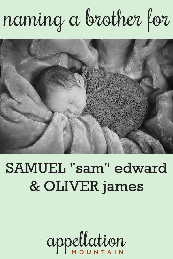 sleeping baby swaddled in dark blanket on velvet blanket; finding traditional boy names like Sam and Oliver