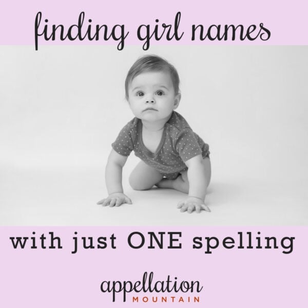 baby girl in dark onesie crawling on plain background; finding girl names with one spelling