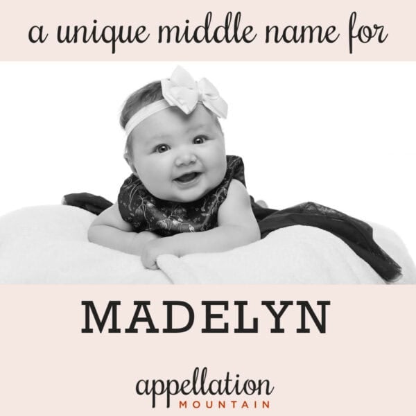 baby girl wearing long dark dress with bow around her head; unique middle name for Madelyn